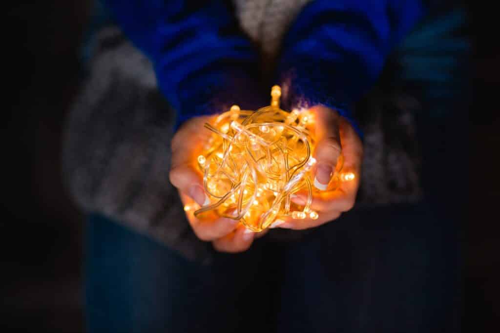 Female hands holding holidays lights